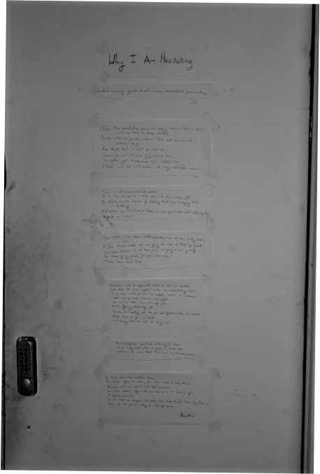 A black and white photograph of a door with the poem "Why I Am Hesitating" by Ana Hine written on it